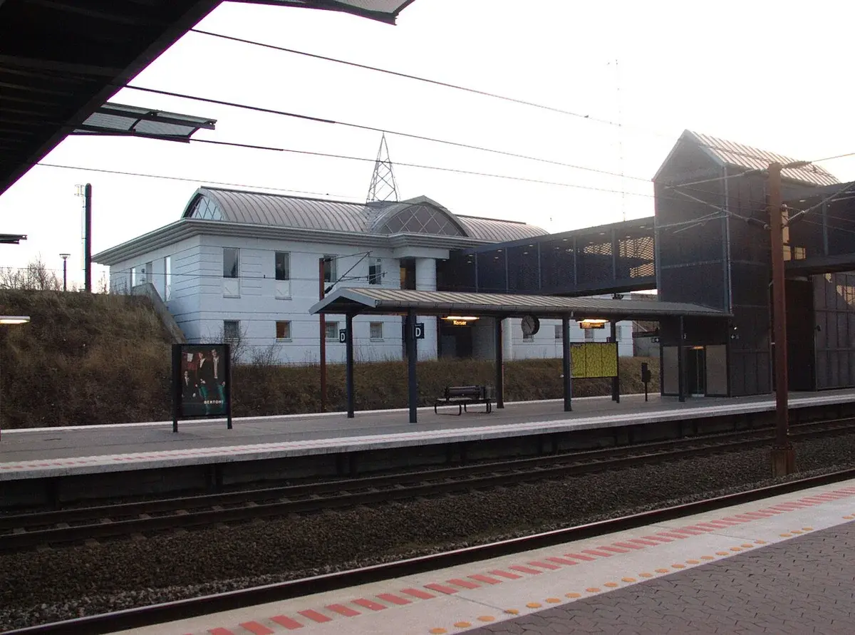 A railway station building and platforms in Korsør, Denmark.