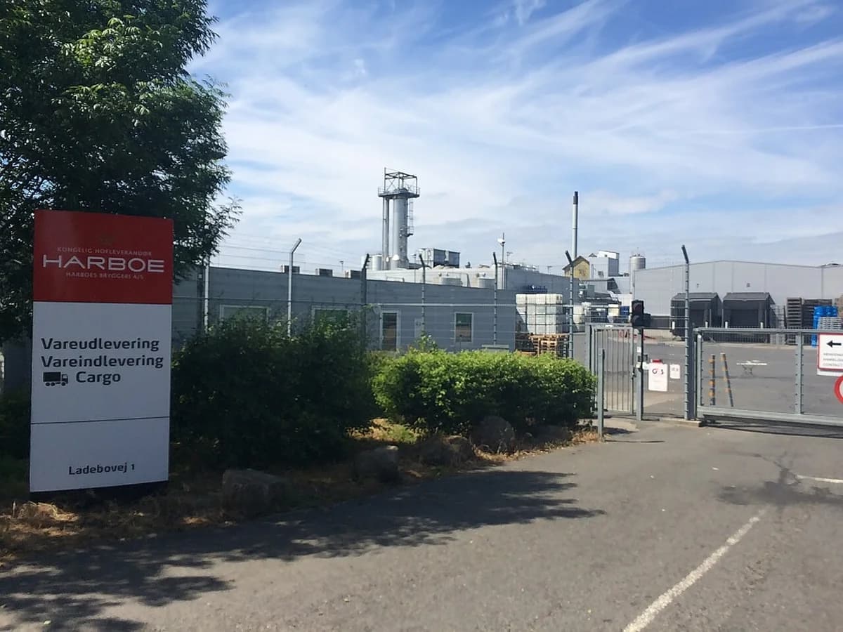 Entrance to a Harboe brewery facility with a cargo delivery sign.