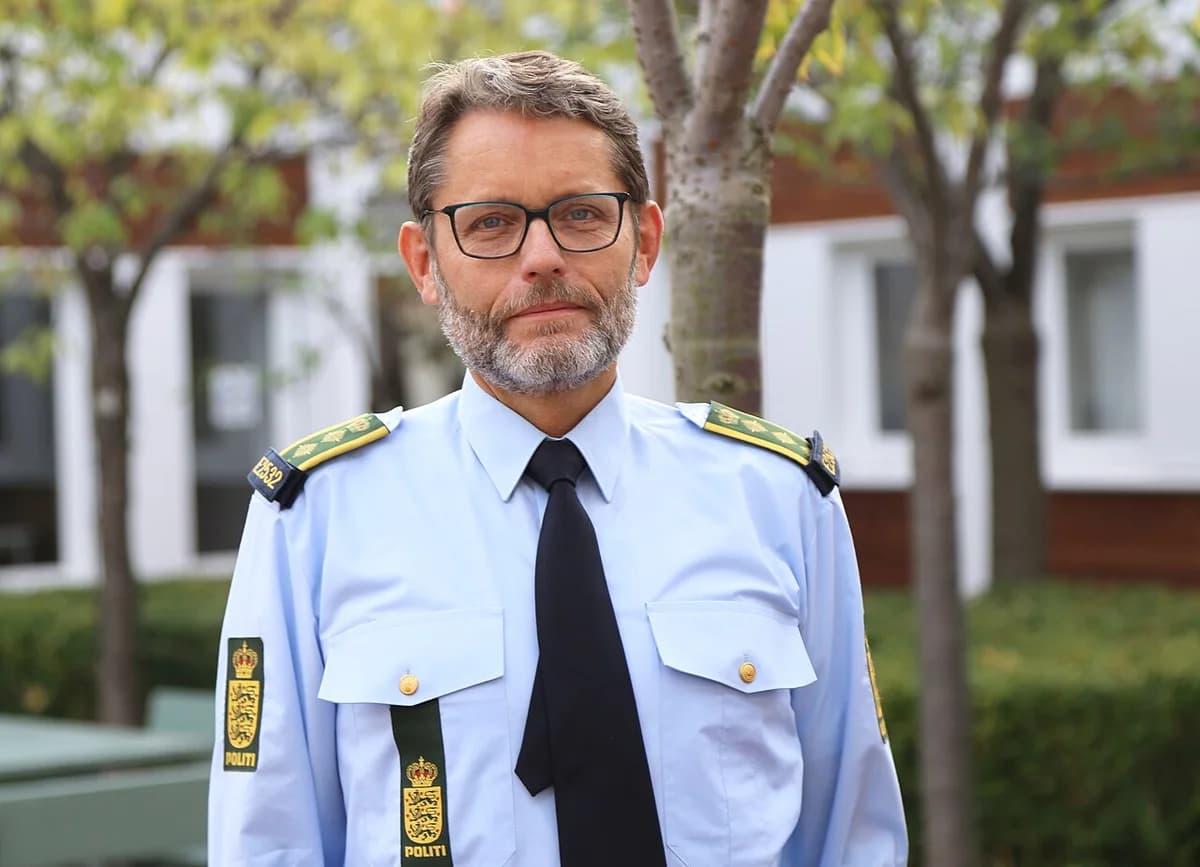 Male police officer in Danish police uniform standing outdoors