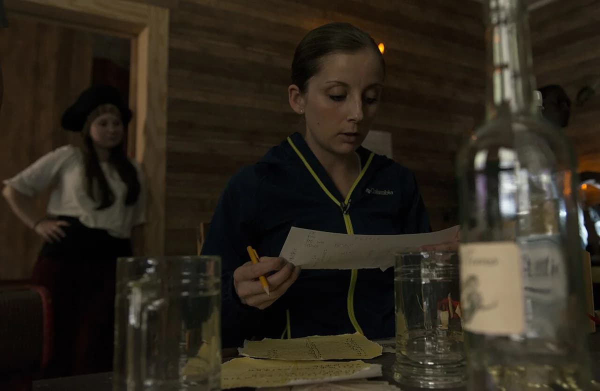 Woman focusing on clues in an escape room