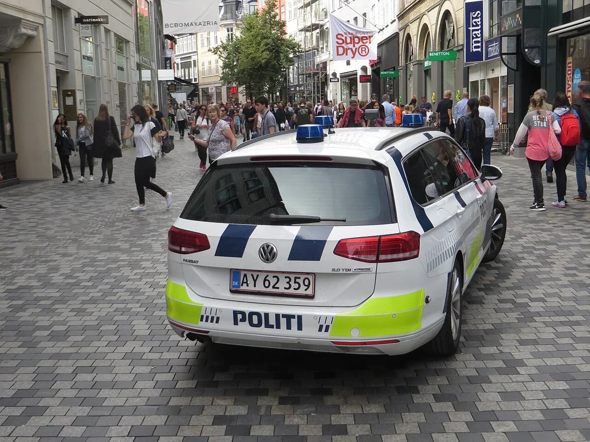 Danish police car on busy pedestrian street in Copenhagen