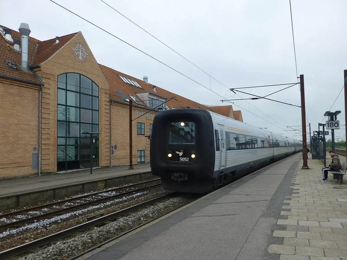 A DSB IC3 train at a station platform in Denmark.