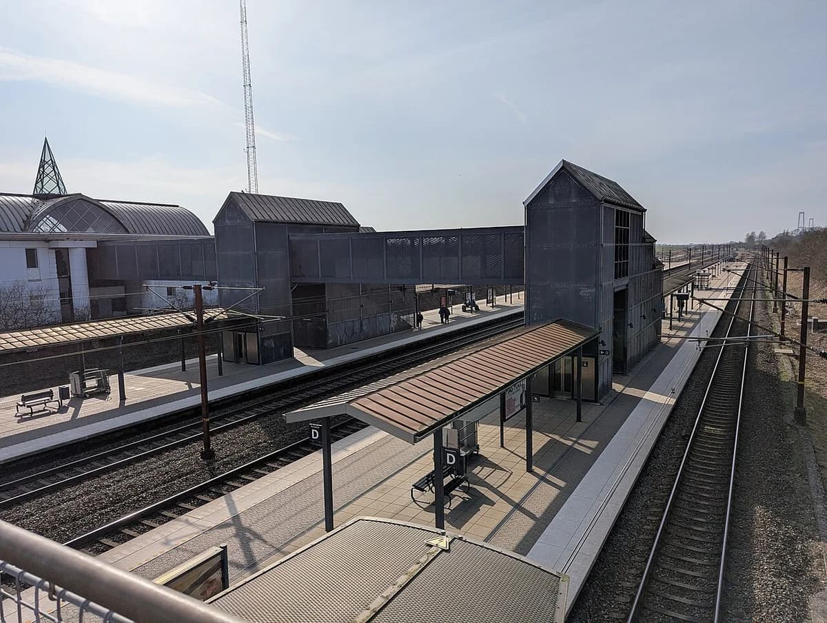 train station platform with pedestrian bridge